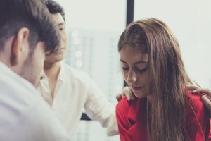 Group problematic young people talking with guidance counselor.